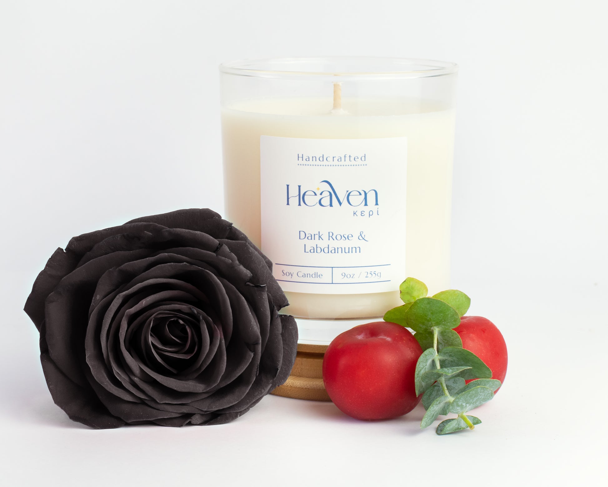Luxury rose and resin scented candle styled for moody interior décor.